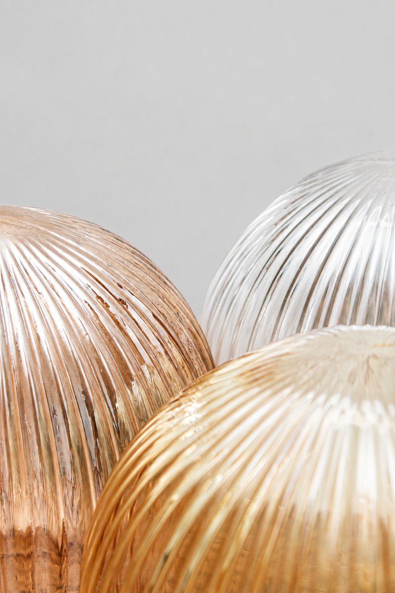 Close up of the reeded glass shades in amber, dark amber and clear. 