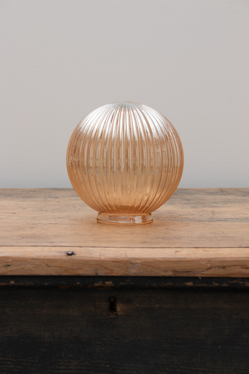Dakota Reeded Glass Shades in dark amber on a timber bench. 