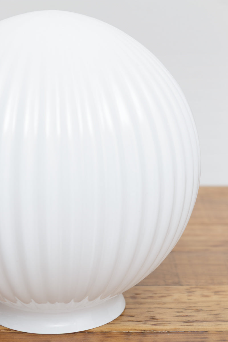 Close up of the reeded  detailing of the opal glass shade.