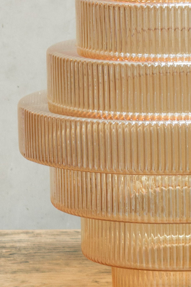 glass shade features multiple tiers of glass 