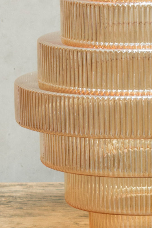 glass shade features multiple tiers of glass 