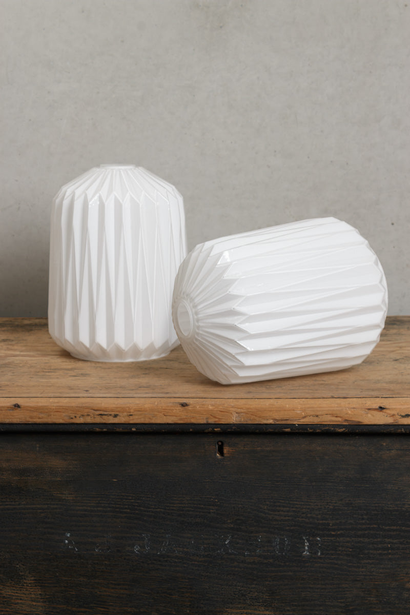 Two uninstalled opal glass shades with an rt Deco inspired geometric design. 