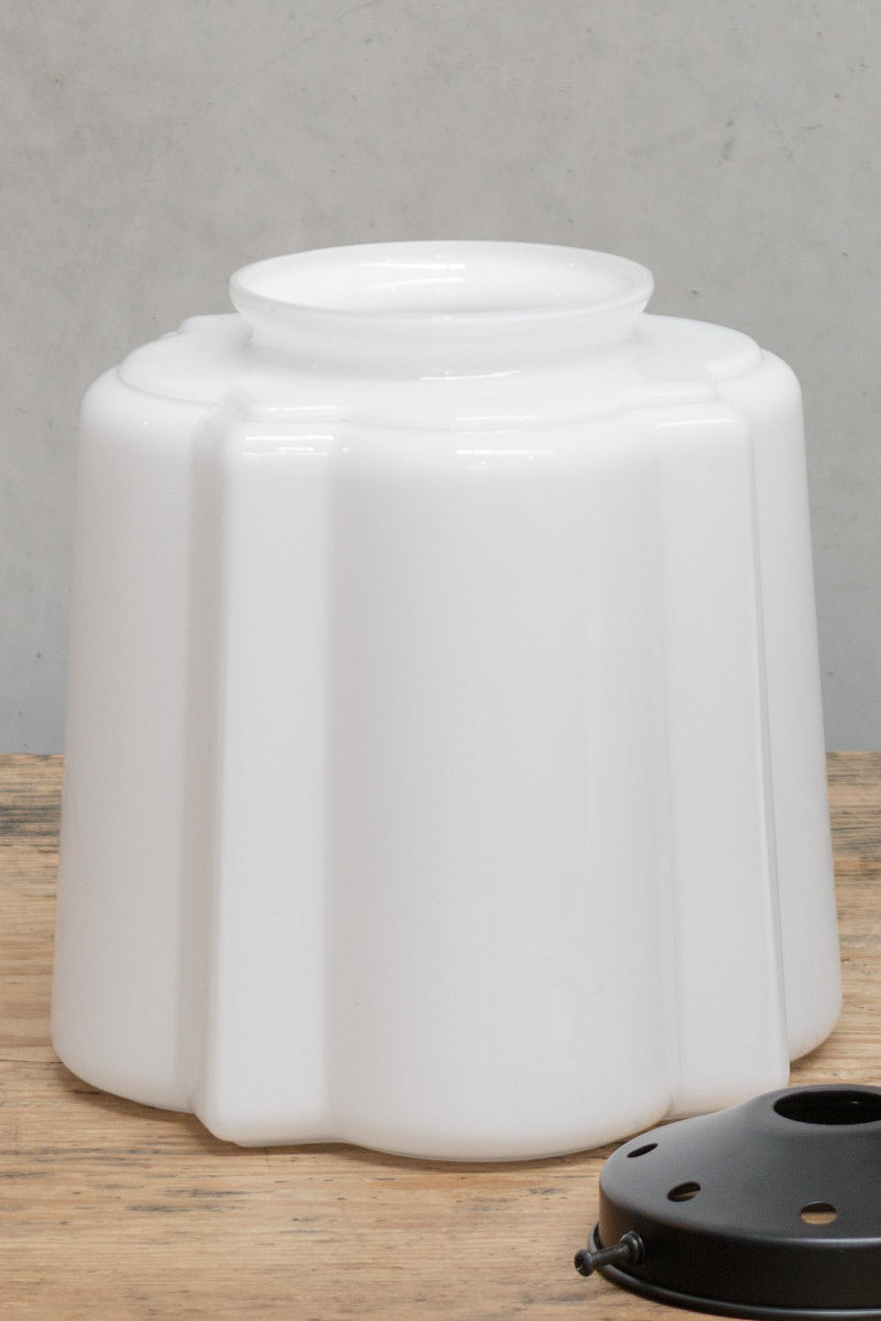 A scalloped shade made of curved glass
