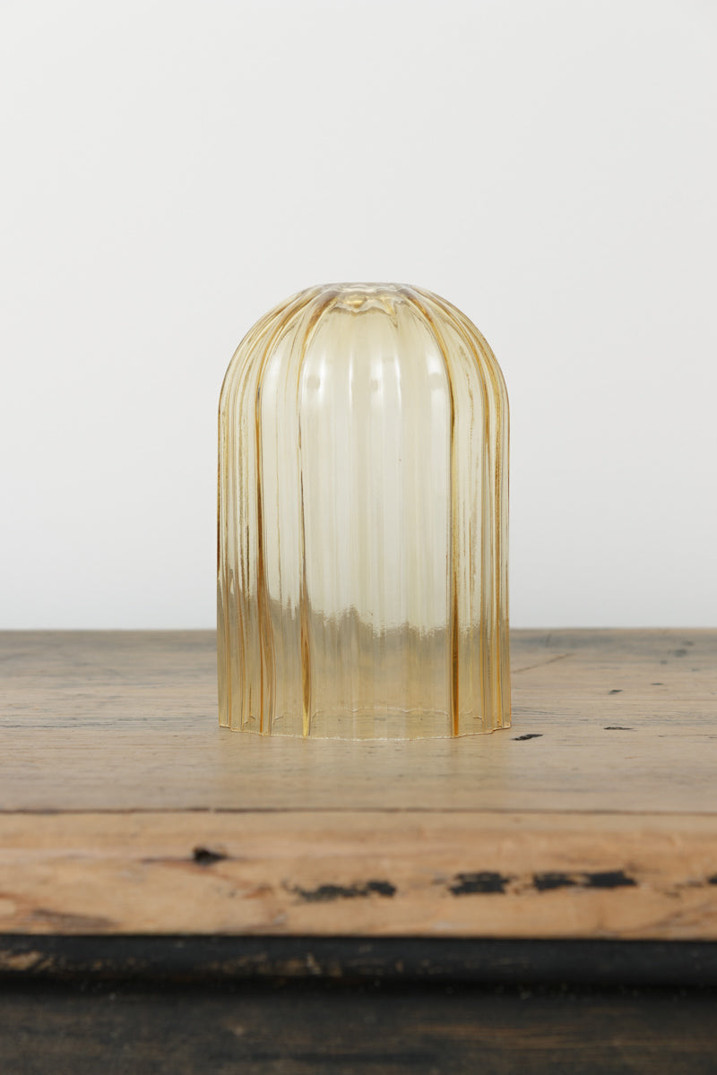 An amberglass shade with an elongated design, it has fluted detailing and fits a B22 lampholder.