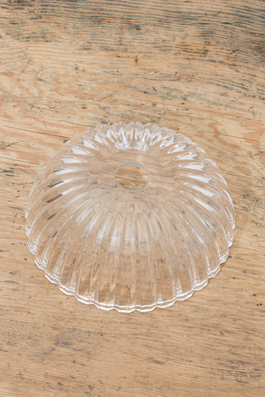 Top view of the Deloraine clear pressed glass shade displaying sculptural linear ridging and circular lampholder opening.