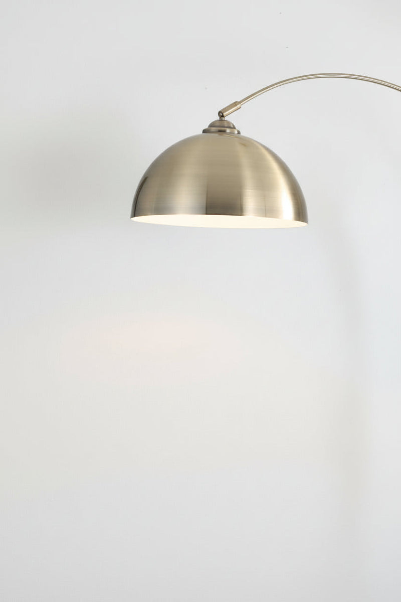 Close up of the antique brass finished floor lamps shade. 