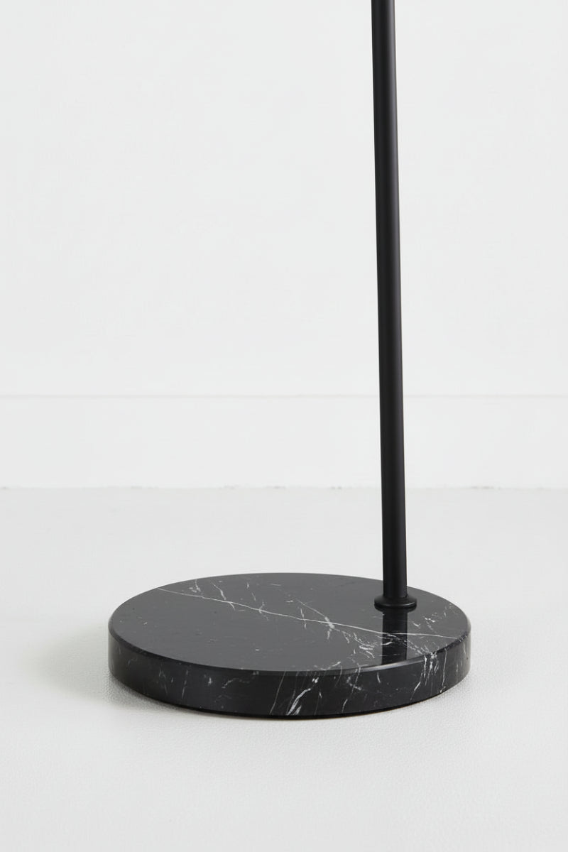 Close-up of the black marble base and black floor lalmp stem. 