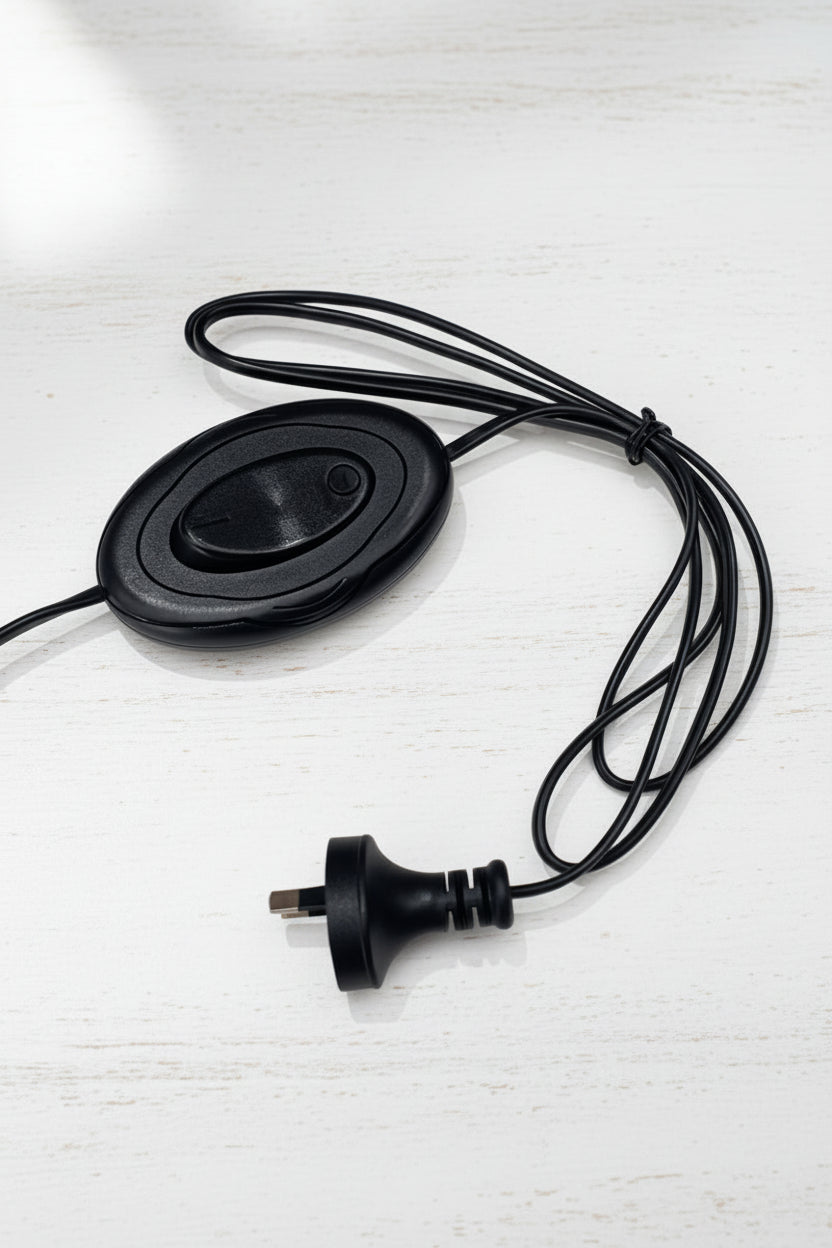 Close up of the black ower cord and inline foot switch. 