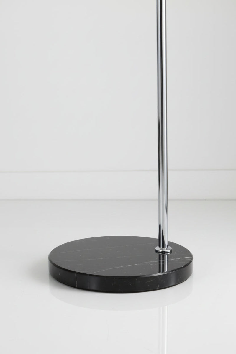 Close-up of the chrome lamp with the black marble base. 