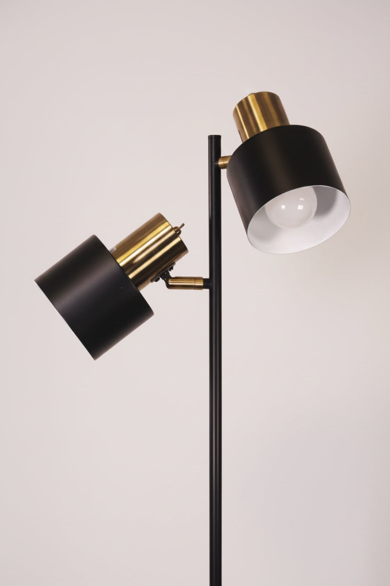 Close up of the 2 light antique brass/ black floor lamp