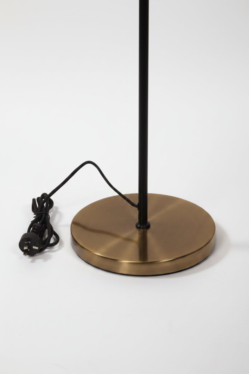 Base of the antique brass and black twin floor lamp