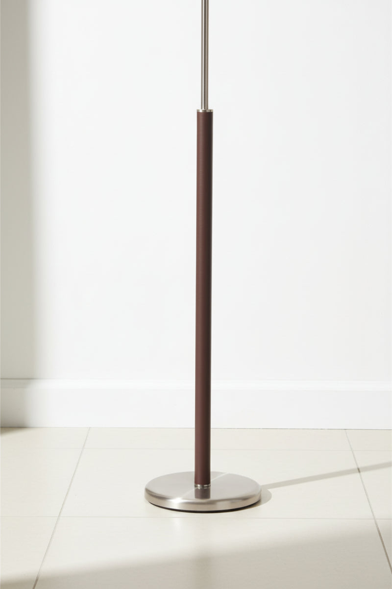 Close up of the floor lamps brown leather detail