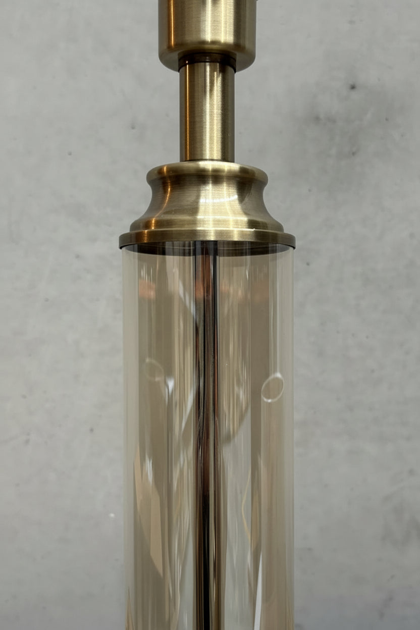 Close up of the antique brass and tinted glass lamp stand