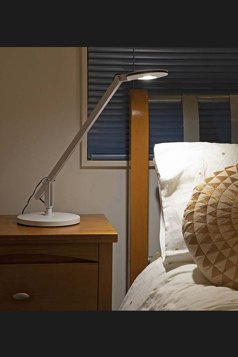table lamp by bedside. the Ruskin Tiltable Task Lamp