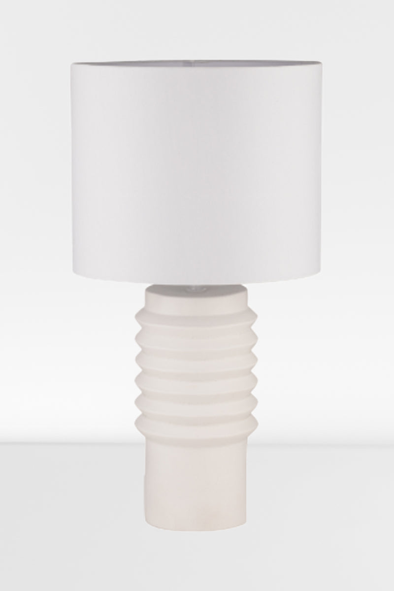 White ceramic based shade with a white linen fabric shade. 