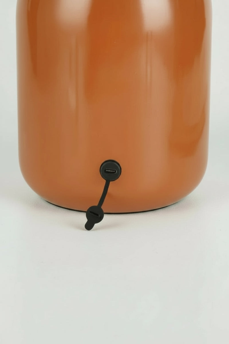 Close up of the charging port of the brown LED mushroom lamp