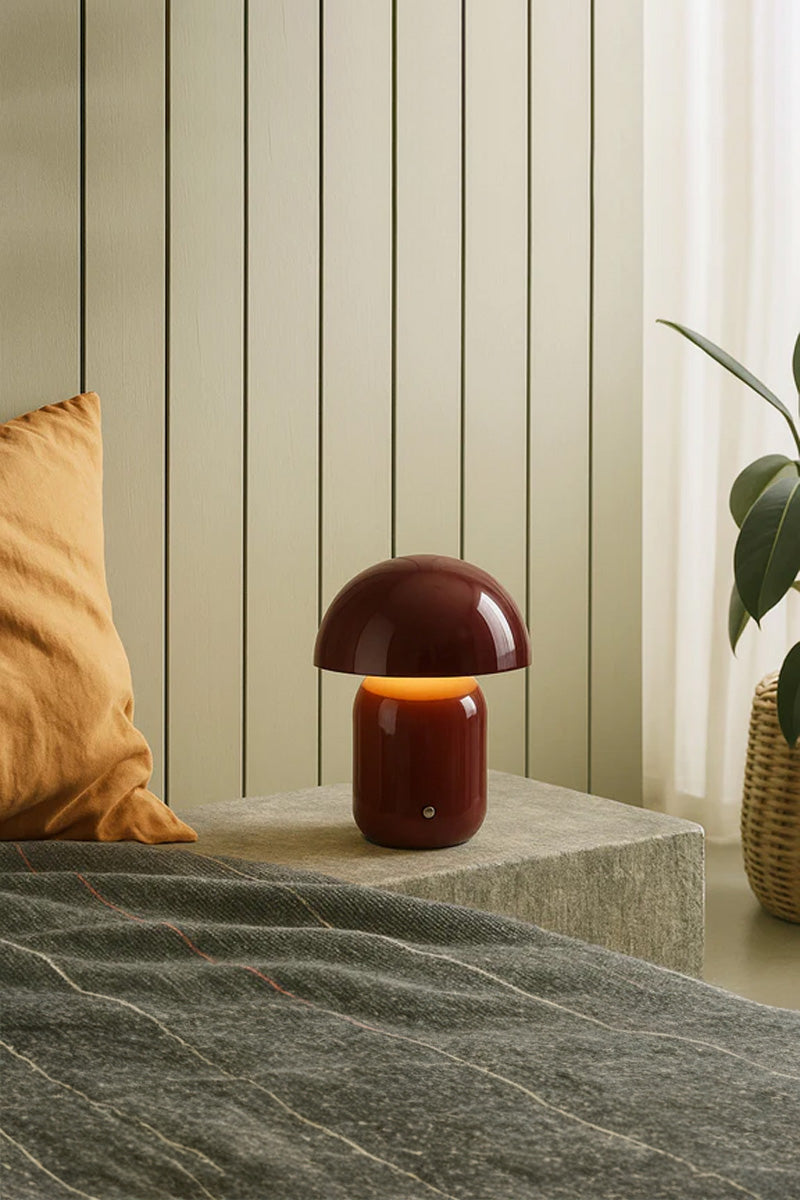 Red illuminated LED mushroom lamp as a bedside light.