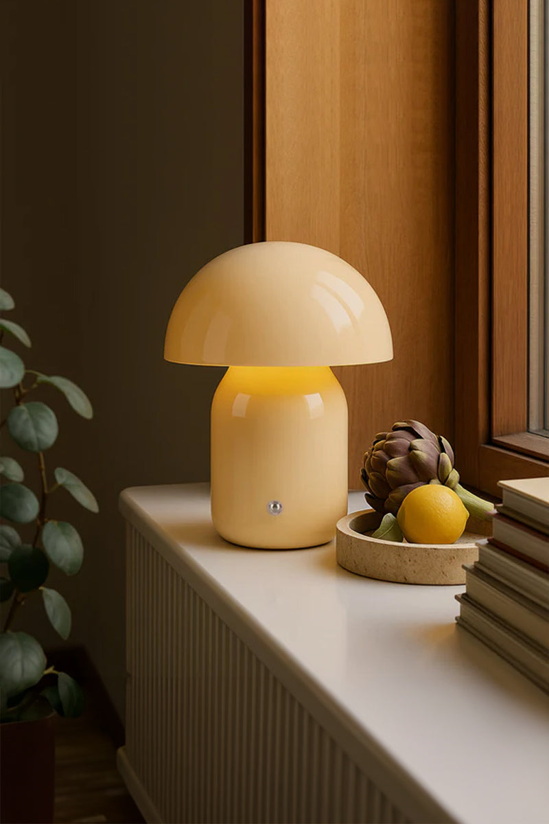 Taupe illuminated LED mushroom lamp on a side table