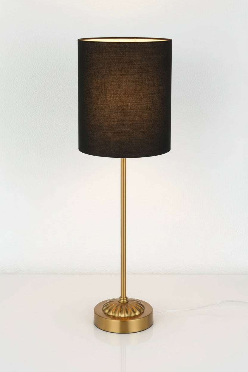 Illuminated antique gold table lamp stand with black satin shade. 