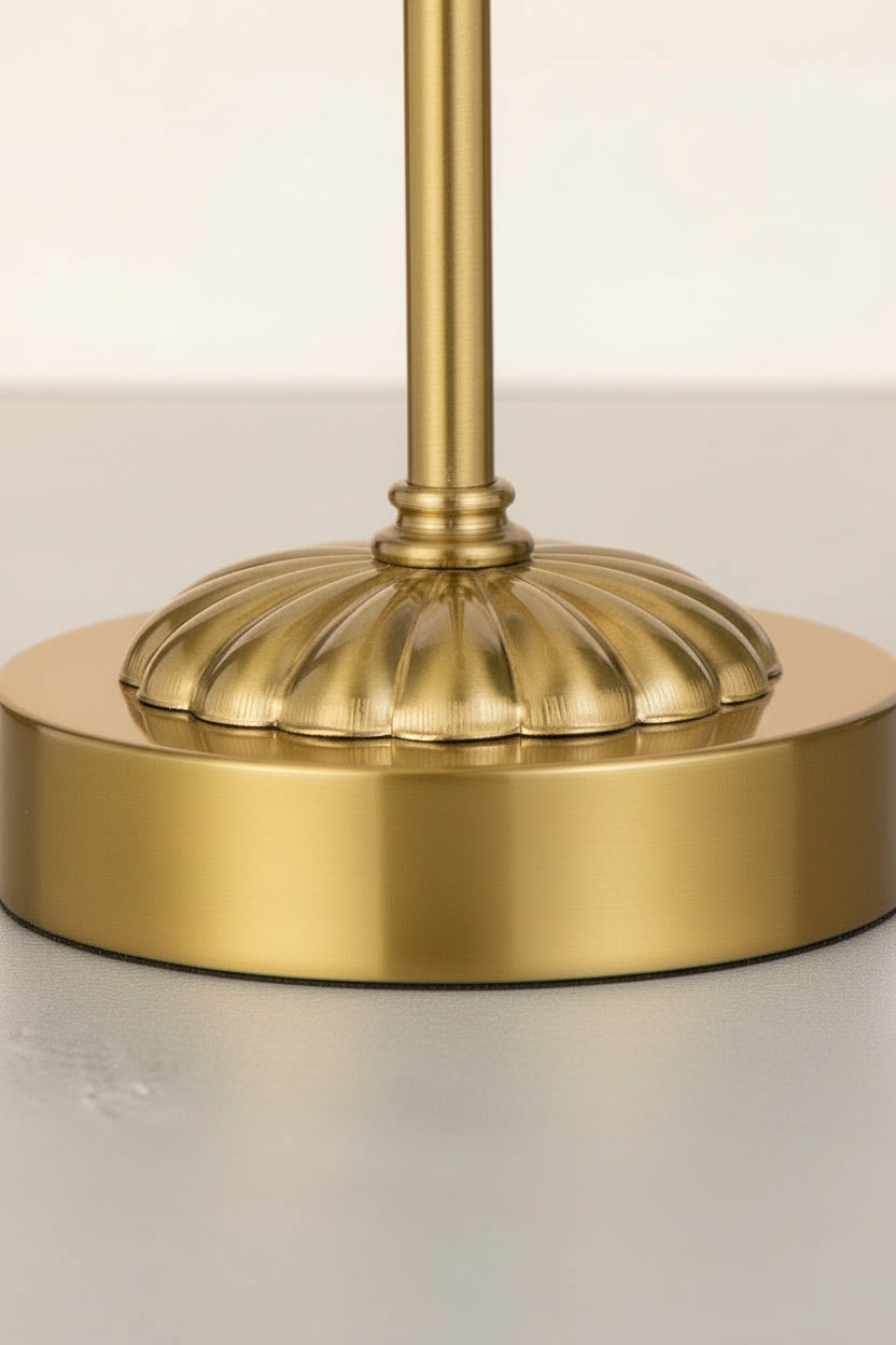 Close up of the detailed base of the antique gold table lamp stand.