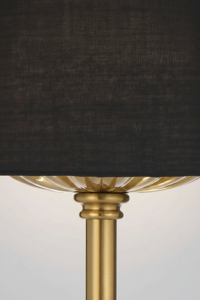 Close up of the antique gold table lamp stand with black satin shade. 