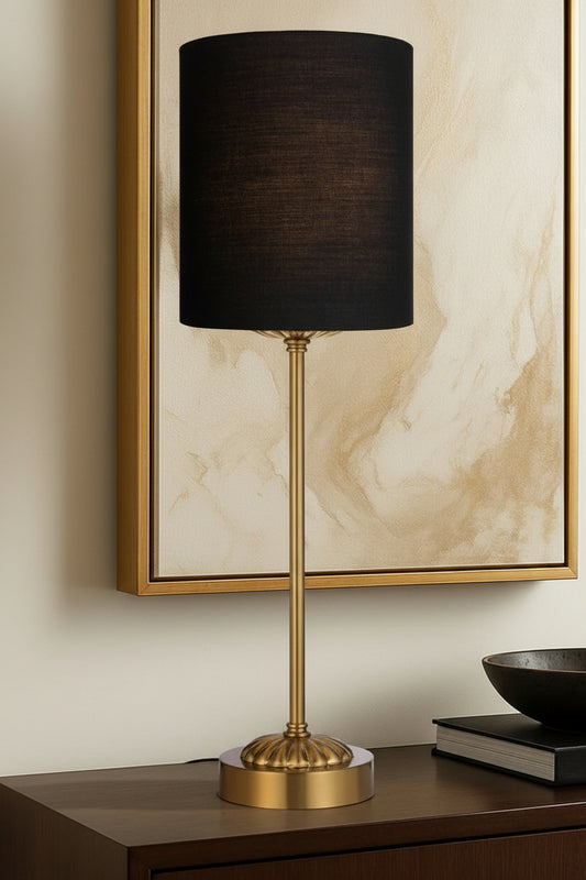 Antique gold table lamp stand with black satin shade on a hall side table