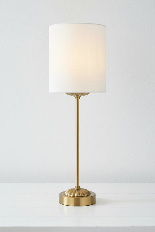 Illuminated antique gold table lamp stand with ivory satin shade. 