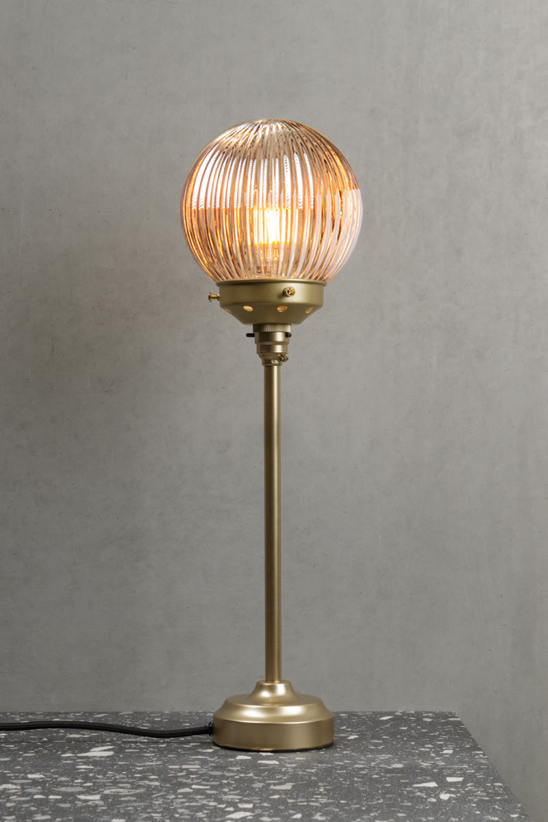 Gold/Brass candle stick lamp stand with a dark amber reeded glass ball shade. 