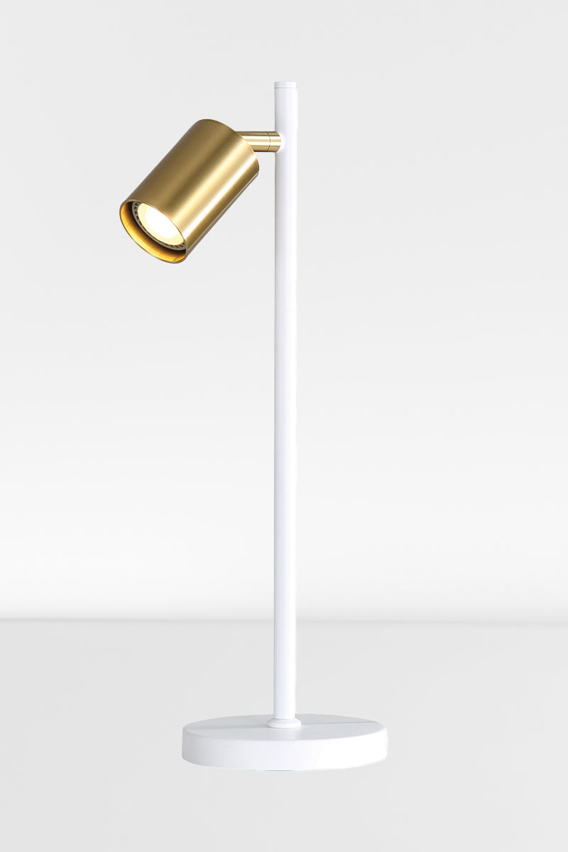 White desk lamp with satin brass spot headand light on. 