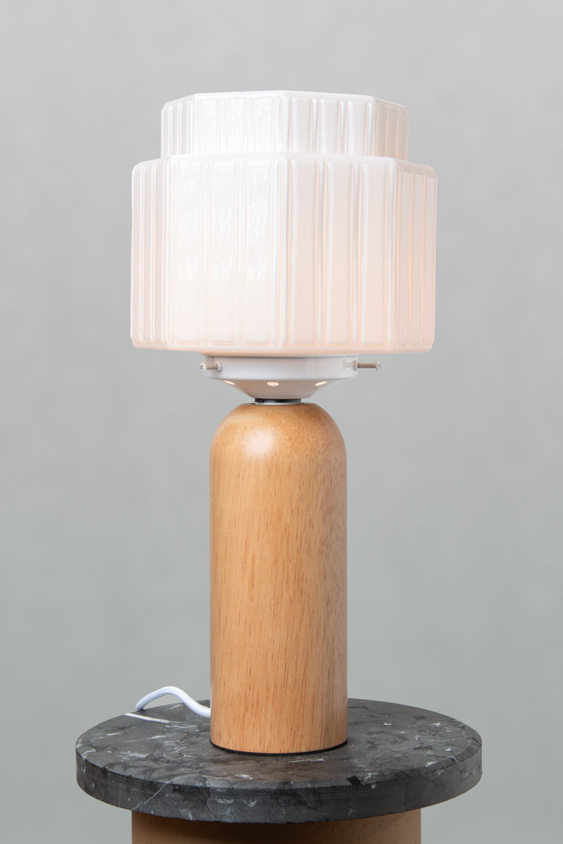 Illuminated Harcourt Wood Table Lamp featuring Art Deco inspired opal glass shade and natural solid wood base.