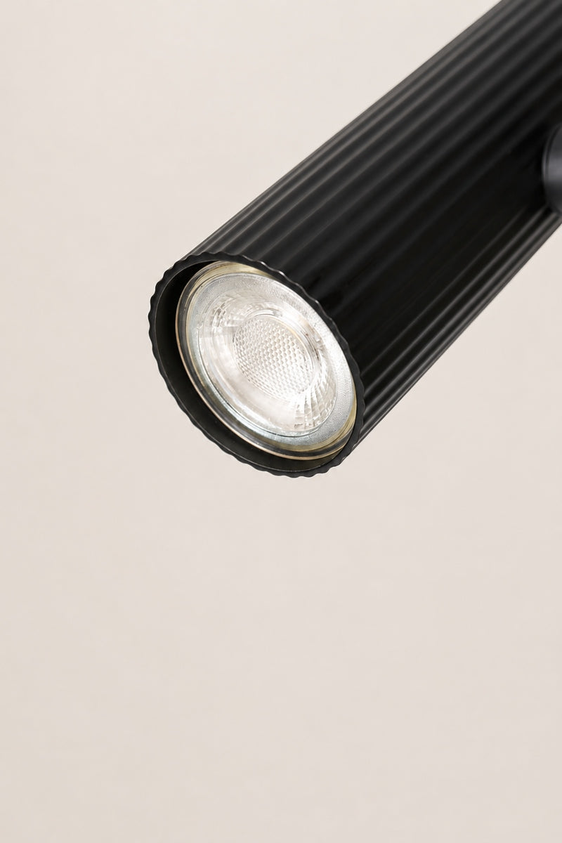 Close up of the tiltable lamp head of the black Collies desk lamp. 