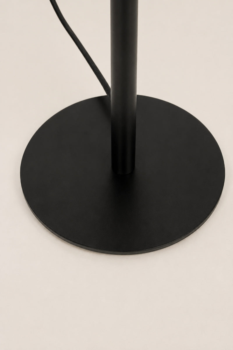 Close up of the base of the black Collies desk lamp. 