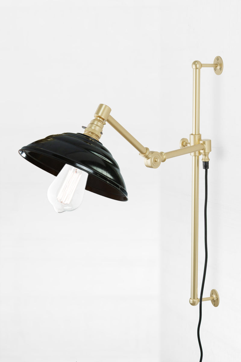 Swing Adjustable Arm Wall Lamp in gold arm finish with Bakelite shade