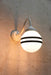 Hand painted opal glass ball pendant light with two stripes on white steel sconce.