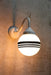 Hand painted opal glass ball pendant light with three stripes on white steel sconce.