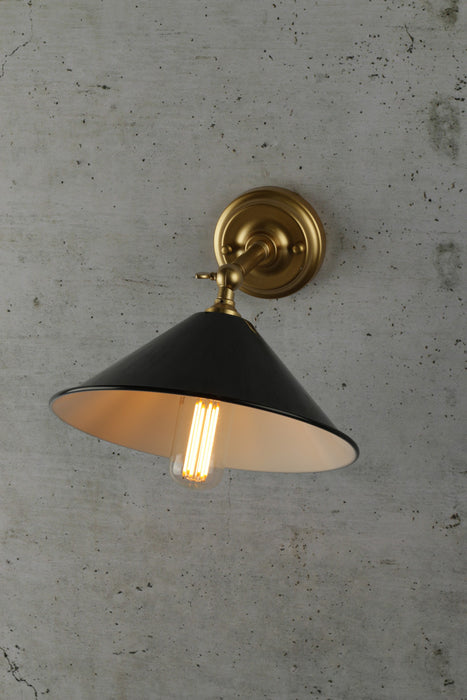 Small black cone wall light with brass arm