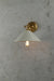 Small white cone wall light with brass arm