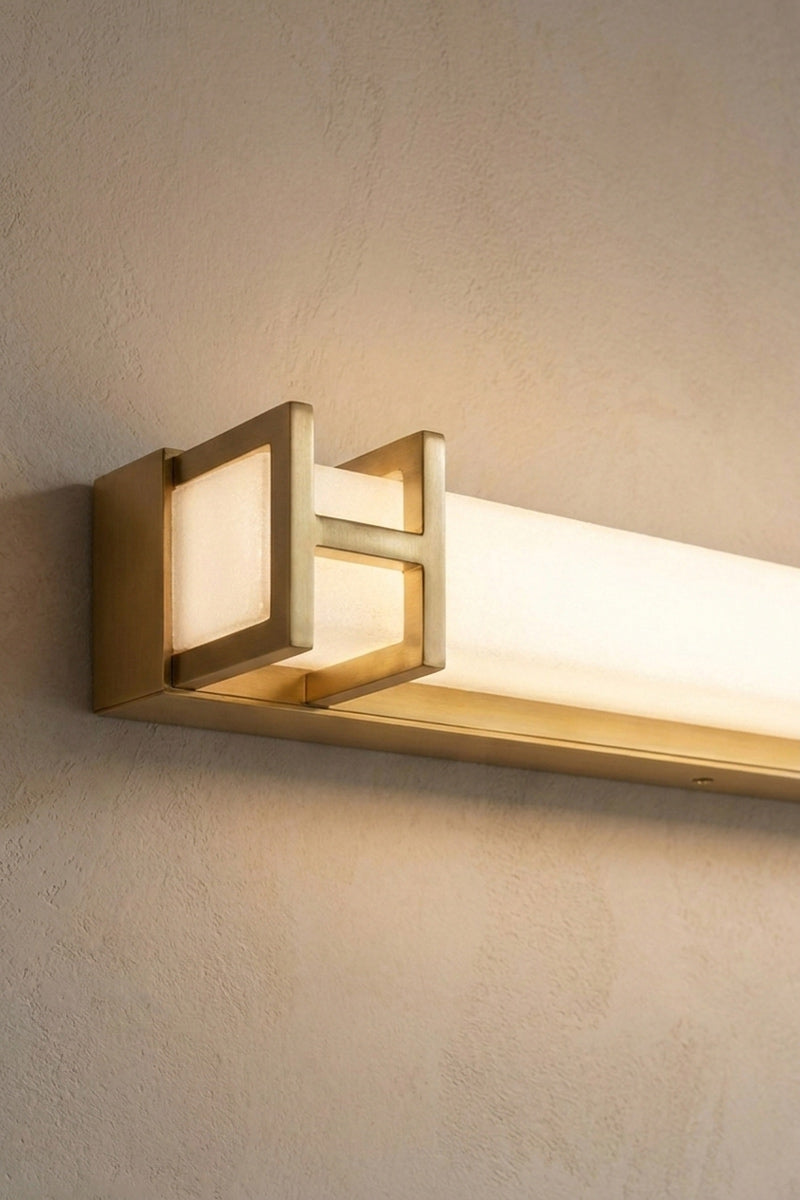 Close up of the antique gold vanity light