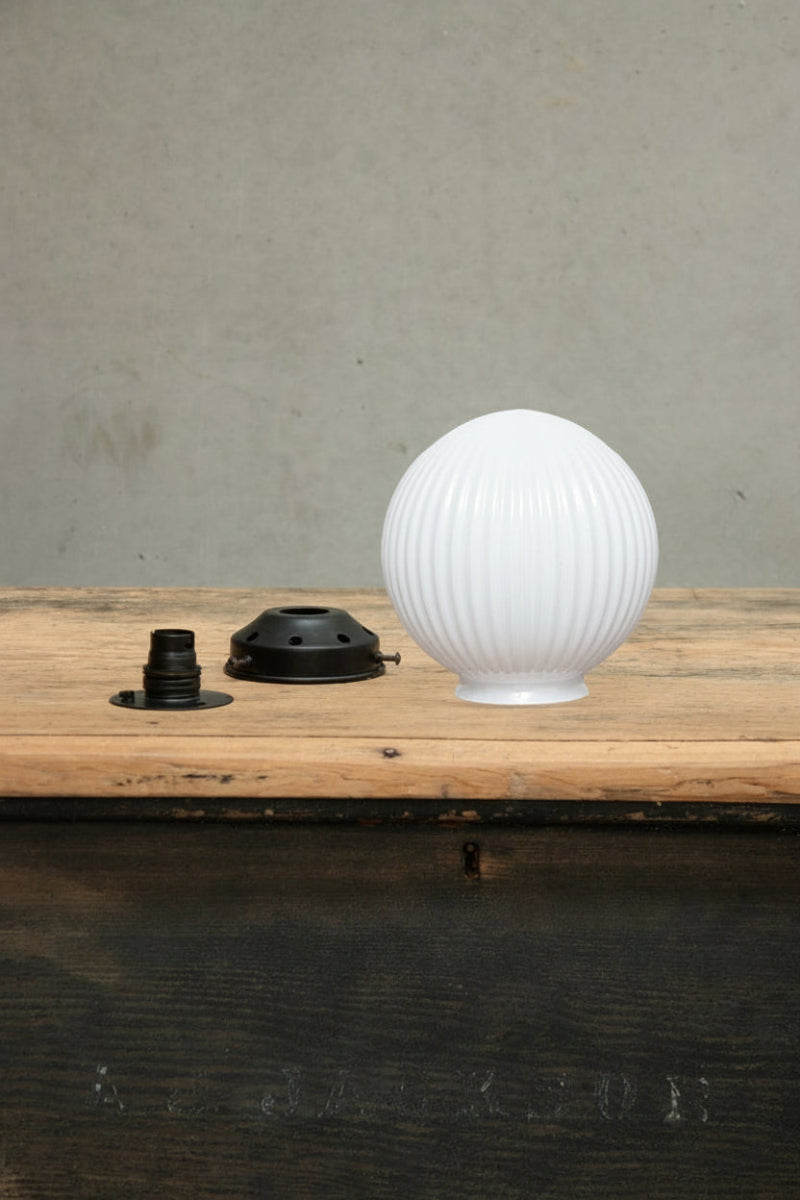 clear glass reeded shade with black wall plate