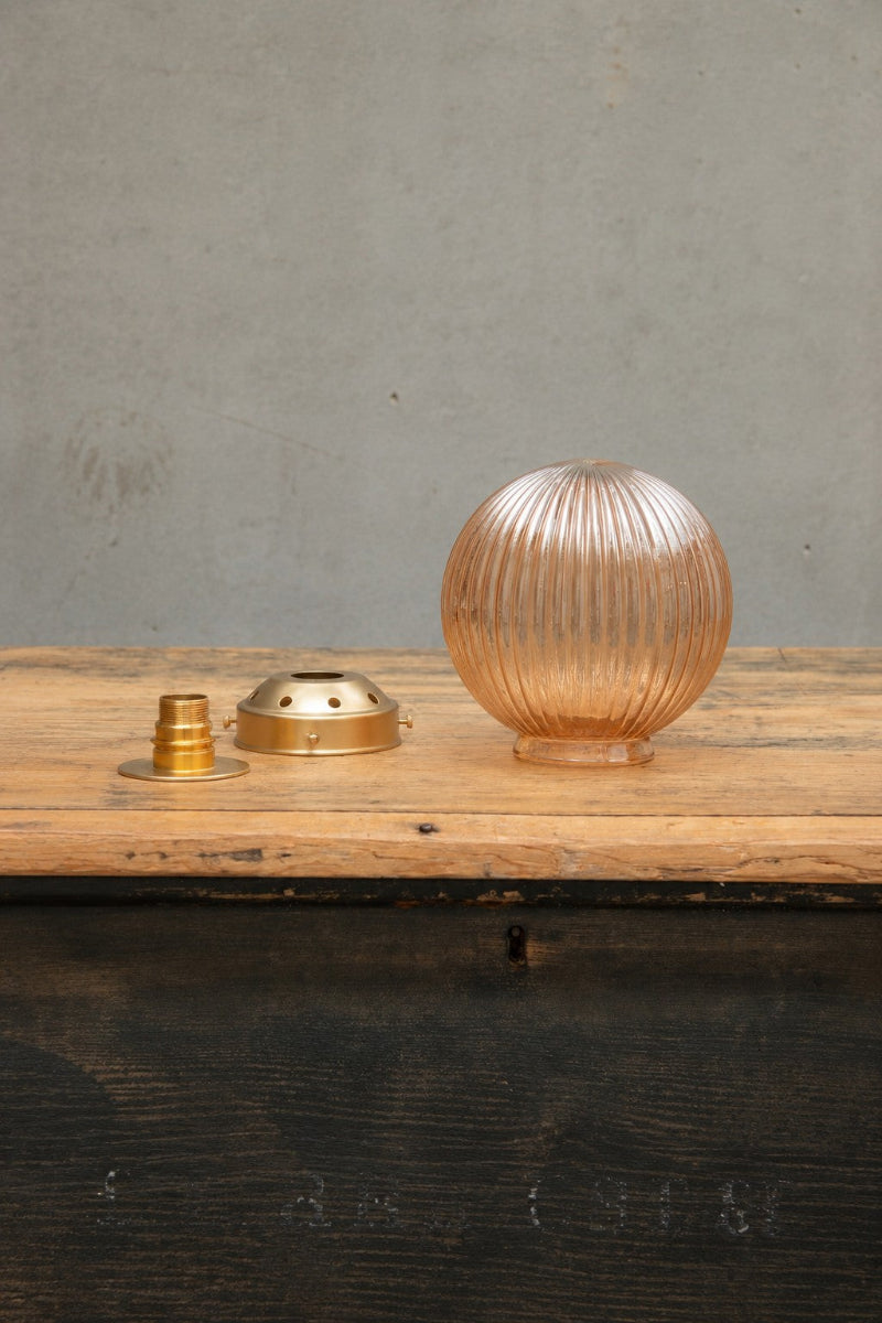 Dark amber glass reeded shade with gold brass wall plate and gallery.