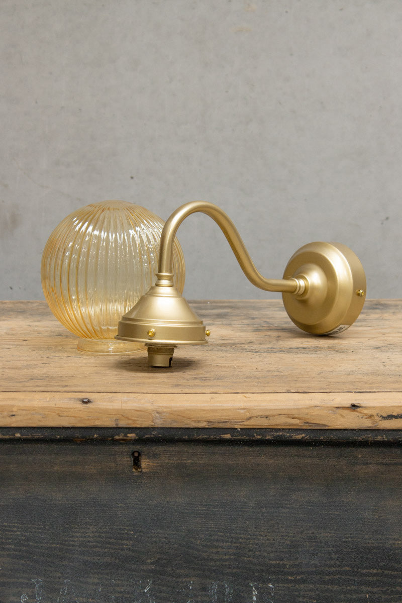 gold brass gooseneck arm and amber reeded shade