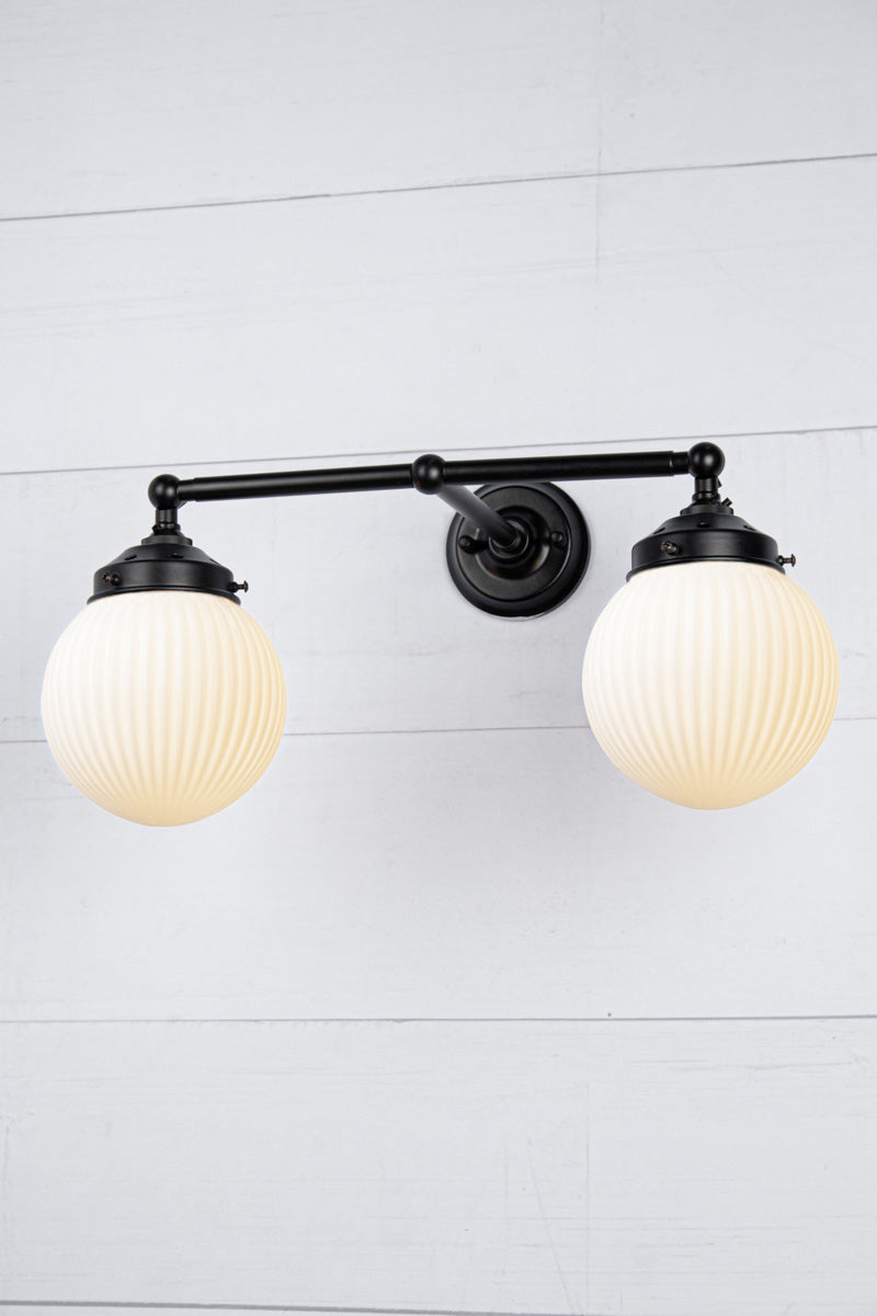 Opal shades with black double arm sconce