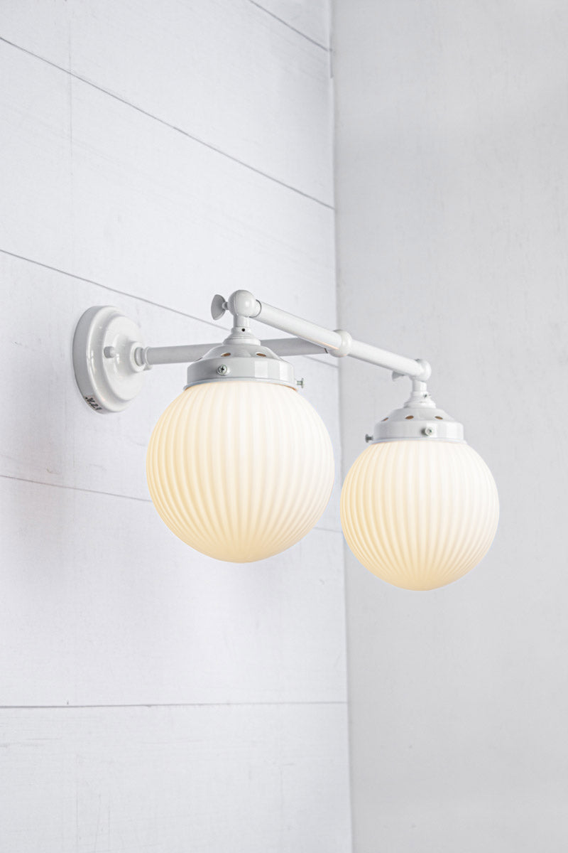 Opal shades with white double arm sconce