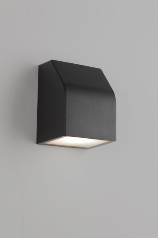 Distinctive industrial-modern outdoor wall light design in matt black. 