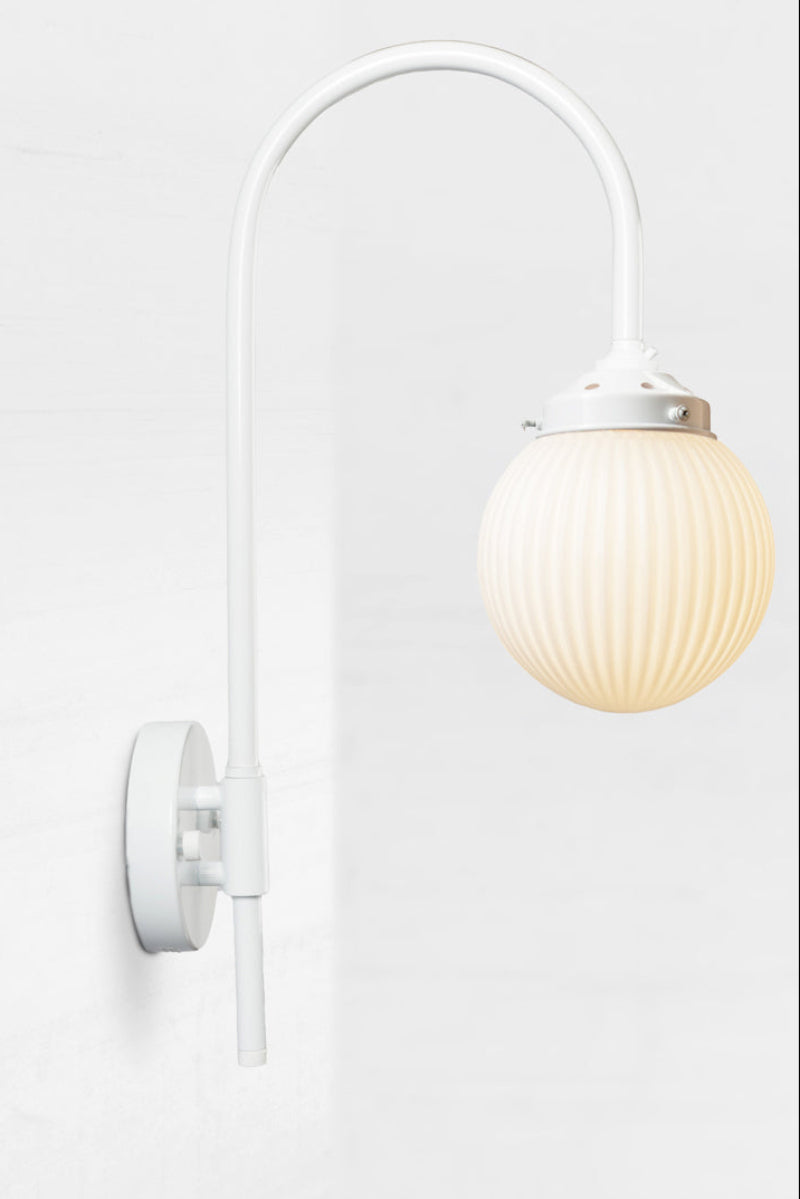 Shepard gooseneck wall light in white with a opal reeded glass ball shade. 
