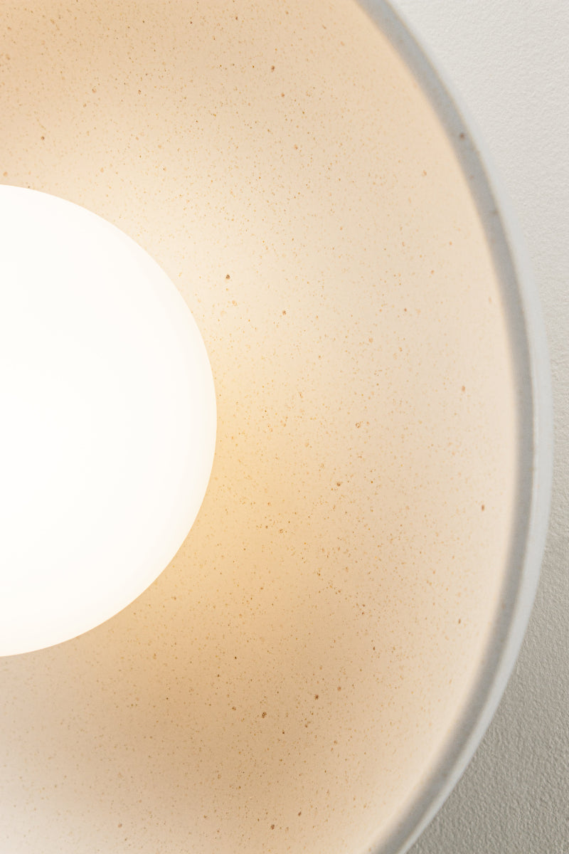 Opal glass ball shade with a white speckled ceramic shade as a flush mount wall light. 