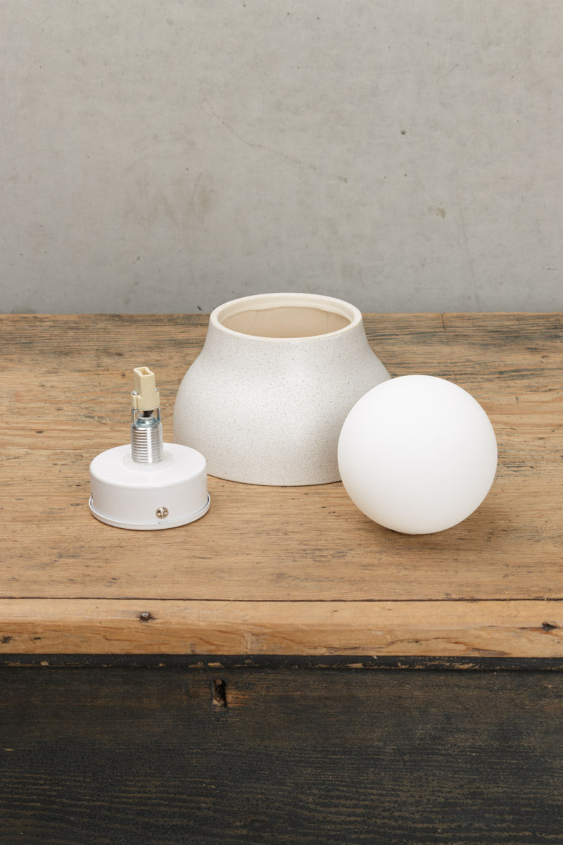 trunk shot of ceramic and glass orb