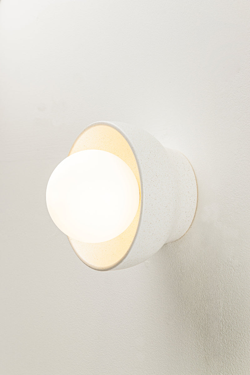 Ceramic bowl wall light with opal glass orb softens and diffuses light