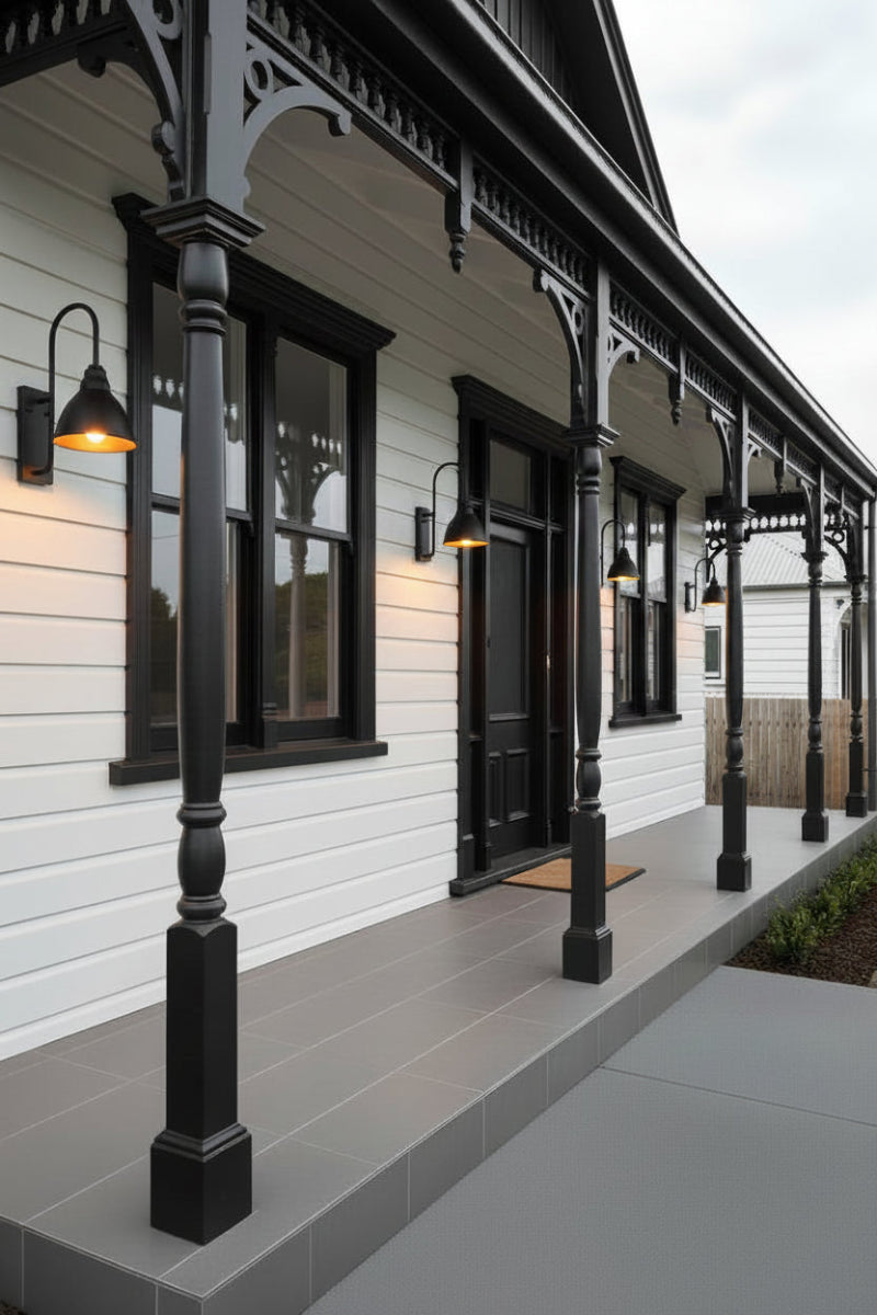 outdoor gooseneck wall lights on a classic Victorian-era cottage