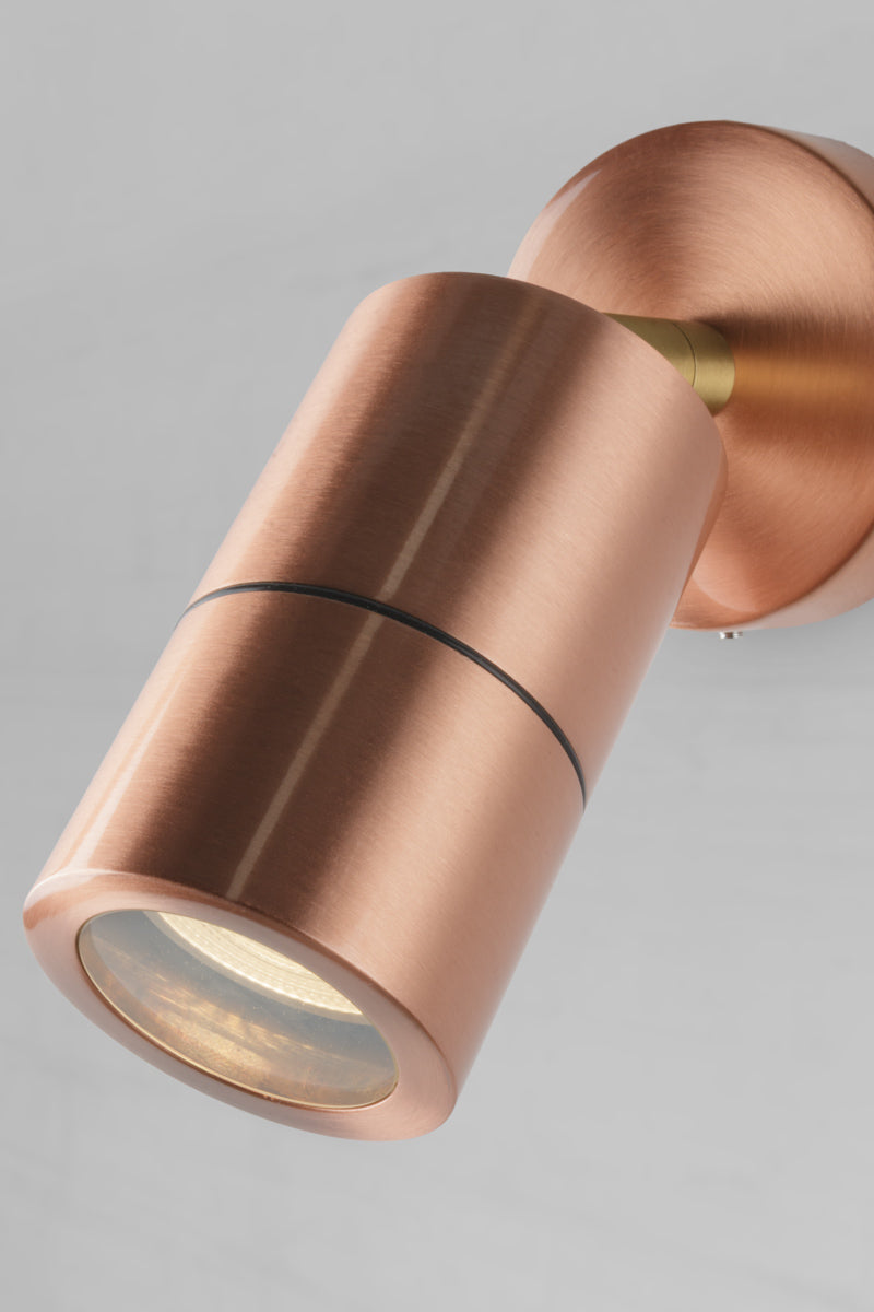 Close up of the finish o the polished copper outdoor adjustable spot light